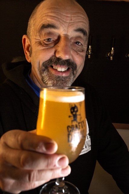 Cardiff, United Kingdom, November 26 2015. Storekeeper Gareth serves up a pint at the Crafty Devil's Cellar bar.