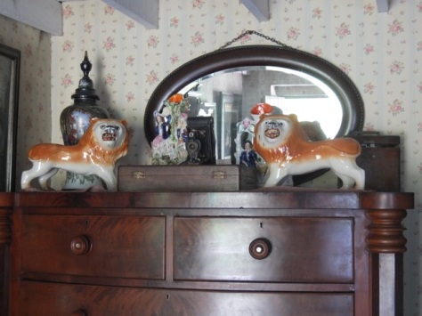  The 1925 interior with patterned wallpaper, and camera